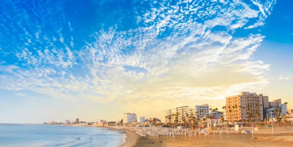 A beautiful sunset over the Larnaca beachfront in Southern Cyprus, highlighting the potential for real estate and property investment for non-residents.